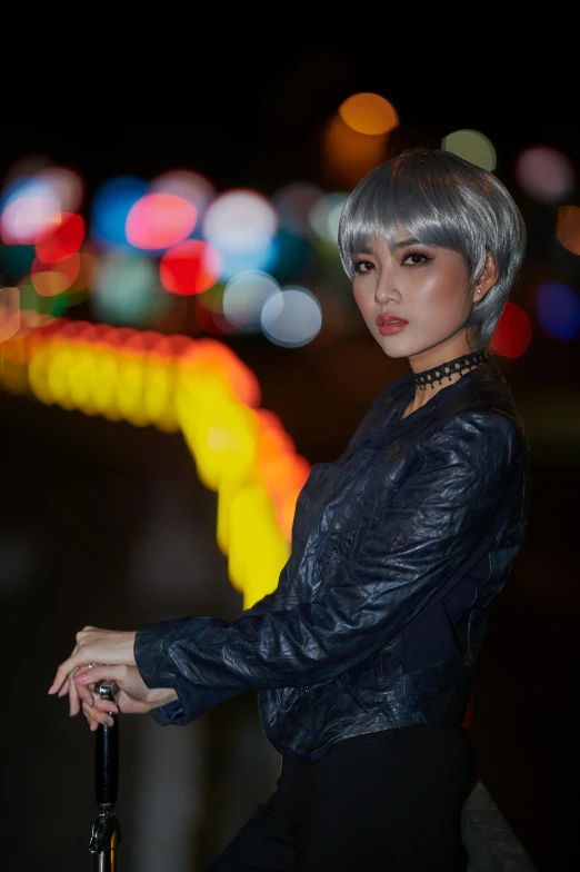 a woman with silver hair is holding an umbrella