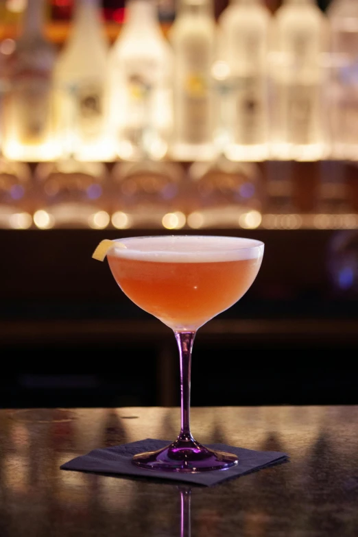 a drink in the glass on top of a table