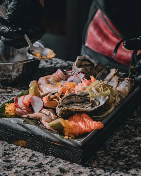 someone is peeling a fish in their sushi dish