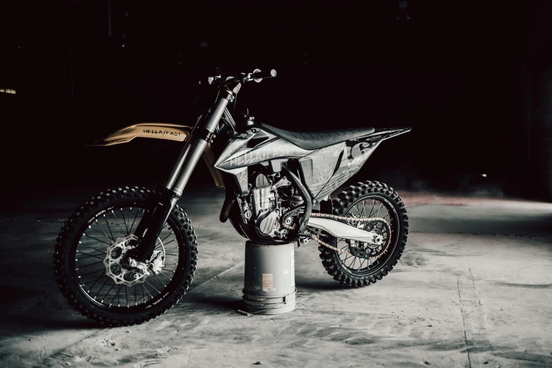 a motor bike parked in a garage near a parking meter