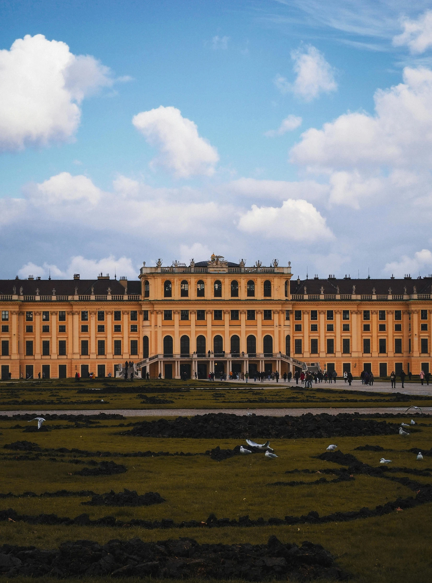 an orange palace sitting on the grass