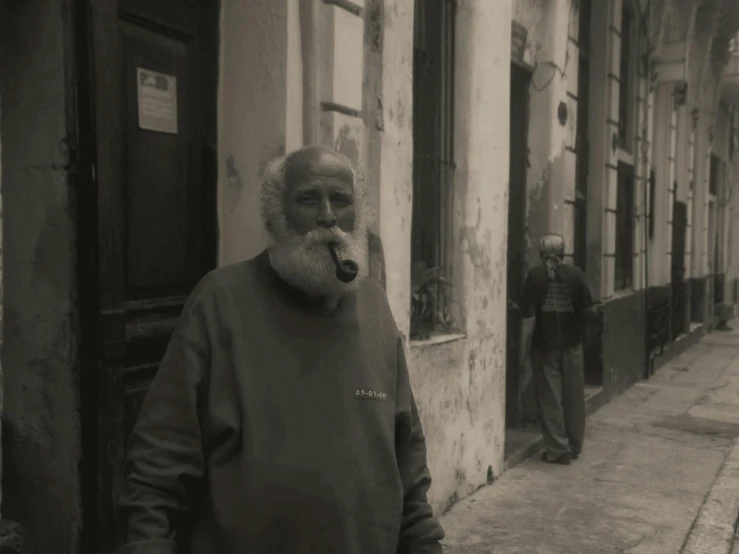 an old man smoking in front of a building