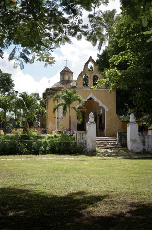 there is a very big church with lots of trees