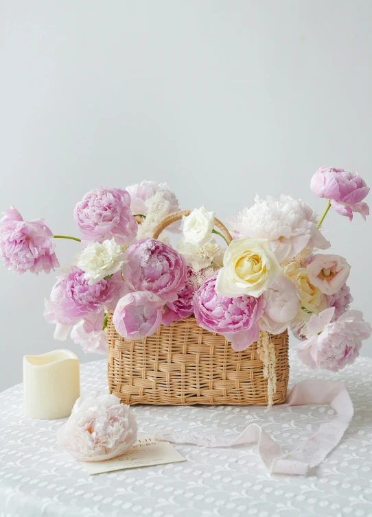 the flowers are in a basket on the table