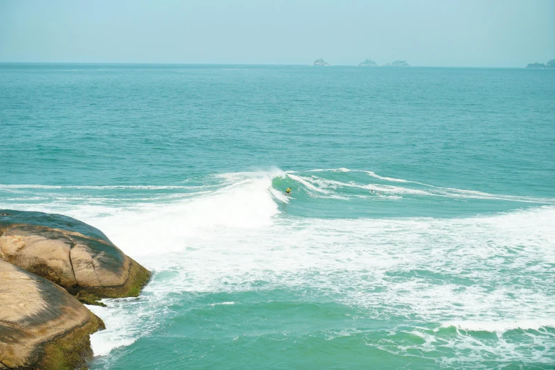 people on surf boards riding in the ocean