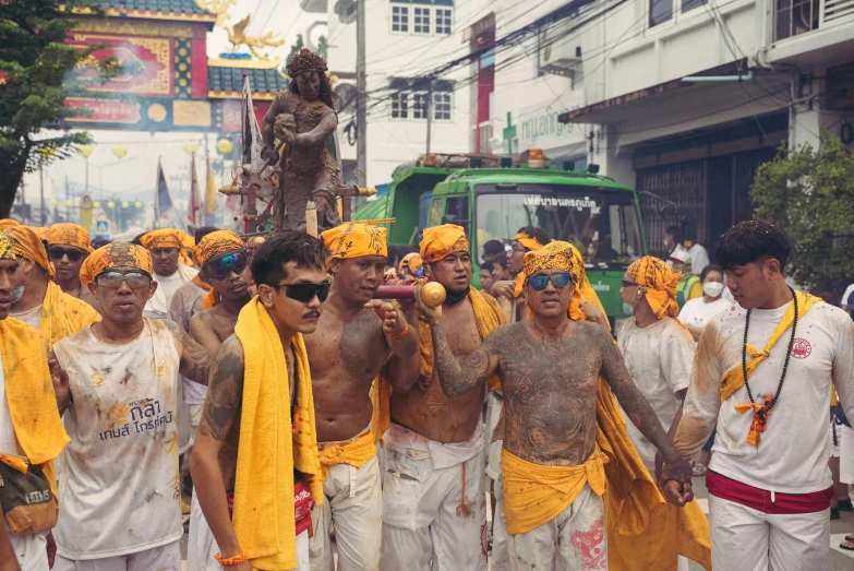 people with different colors make up wearing costumes and walking