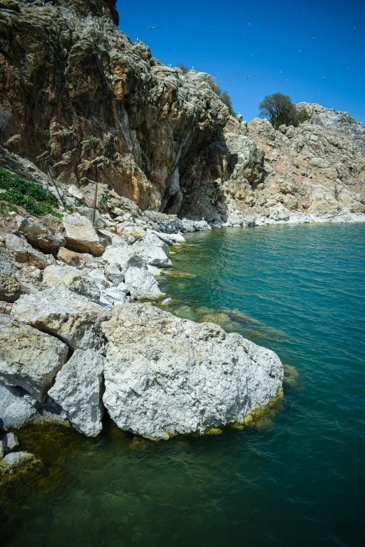 a body of water near many rocky shore