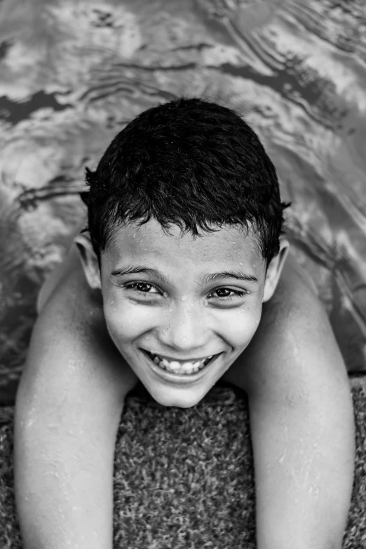 an image of a child smiling in the water