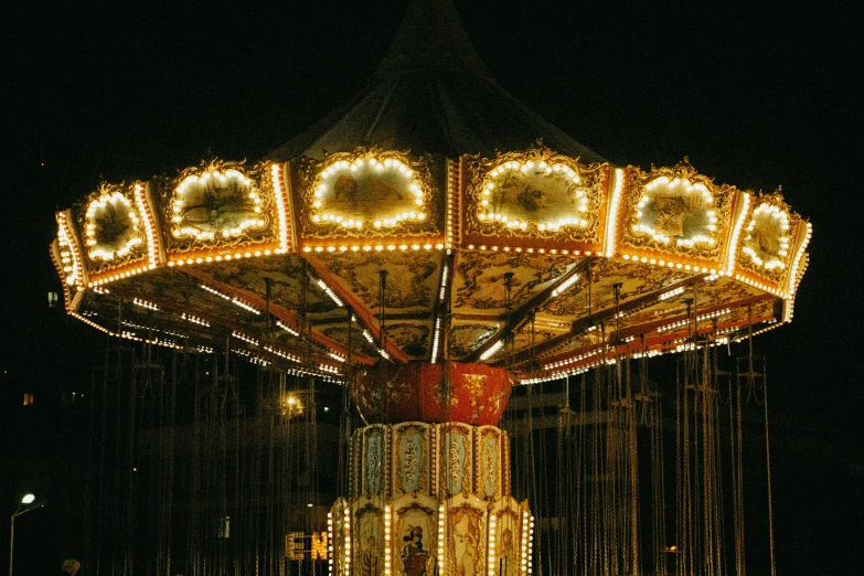 a lighted merry go round at night