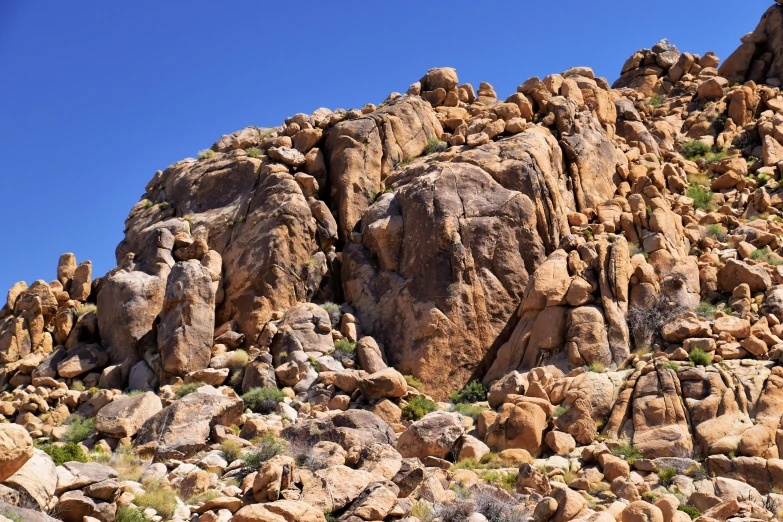 a rock wall on the side of a mountain