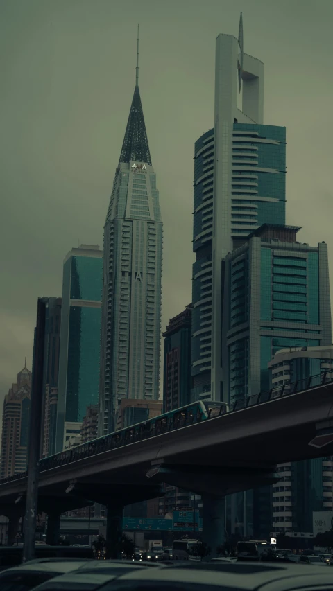 a city with some tall buildings in the foreground