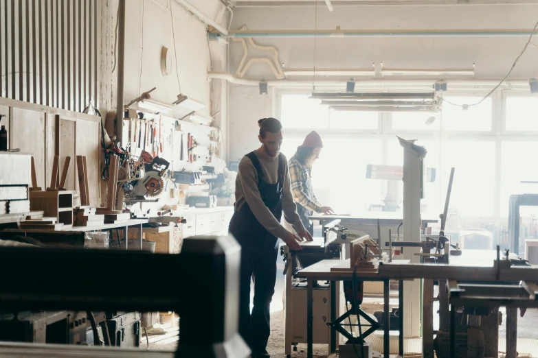 there is a man that is standing near a woman in the shop