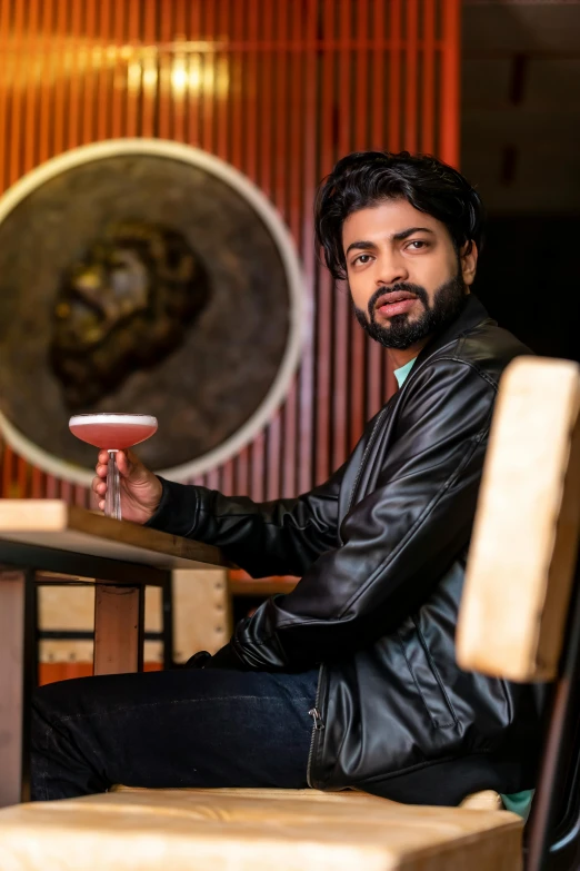 a man sitting at a table looking to the side