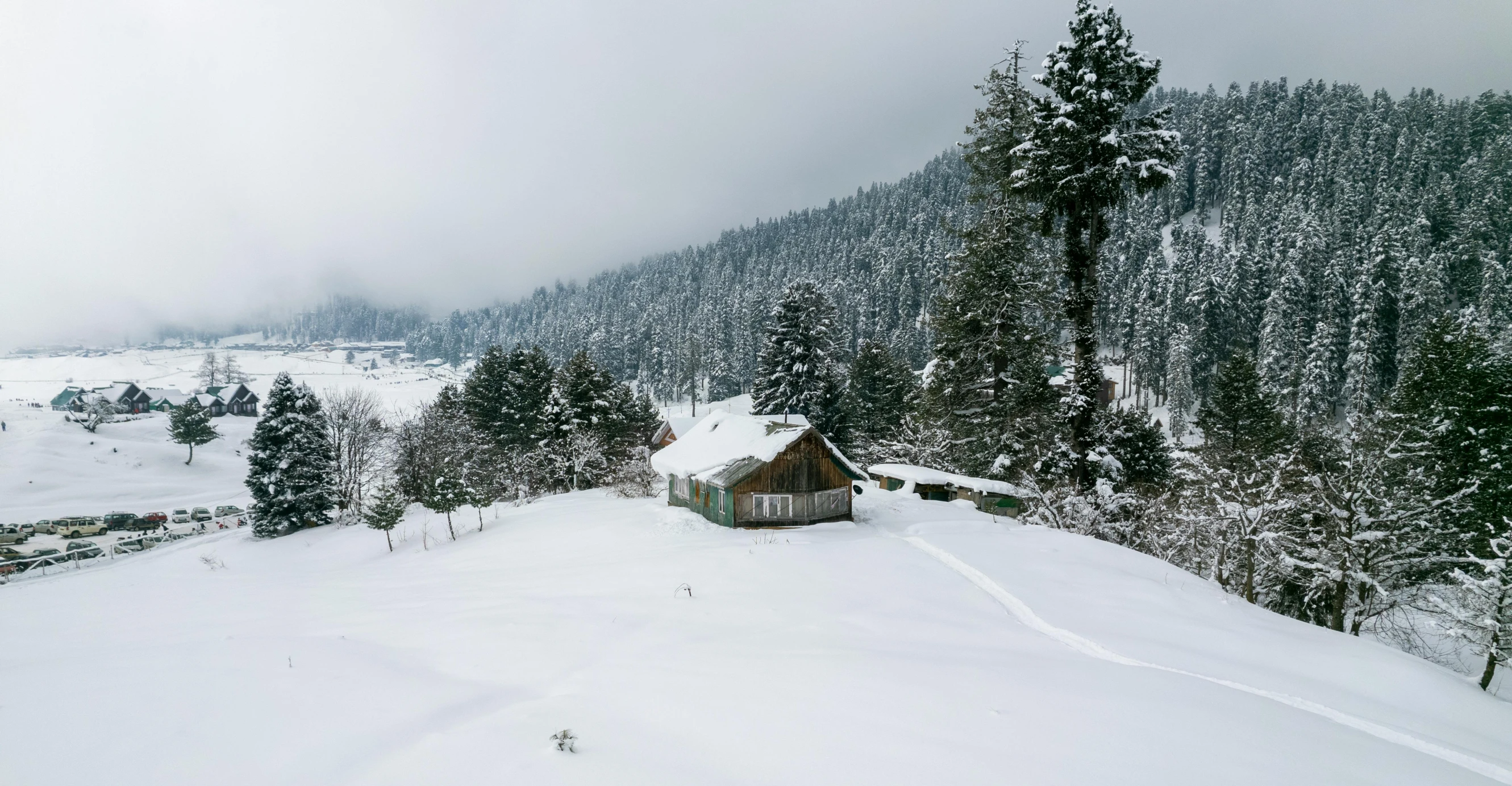 the snow - covered mountain is covered with lots of snow