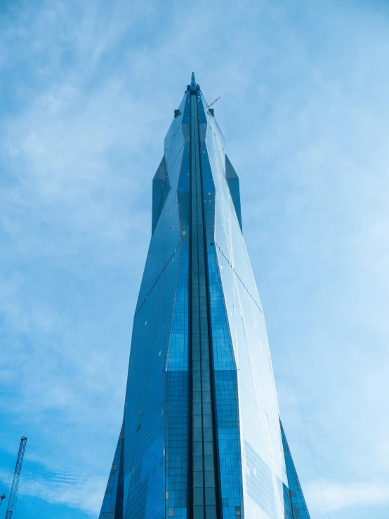 a tall building with a very pointed roof