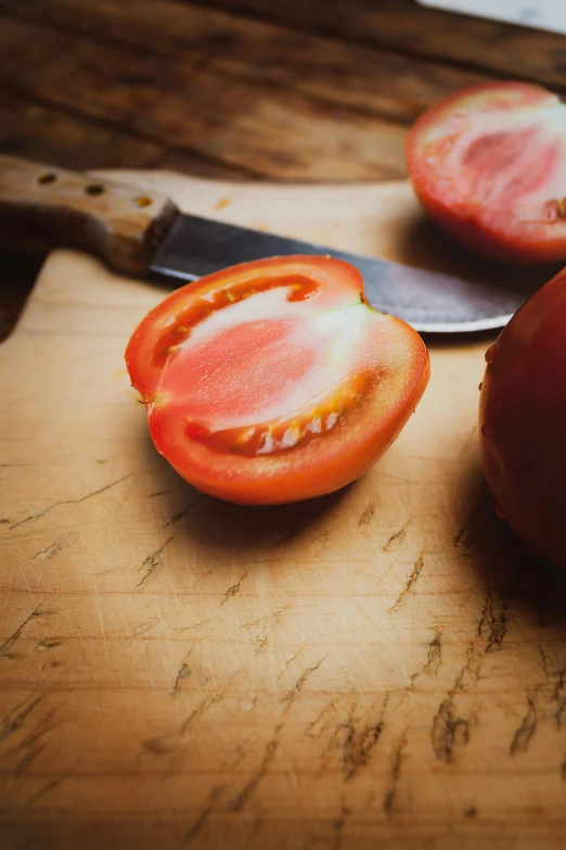 there is one tomato that has been cut into small pieces