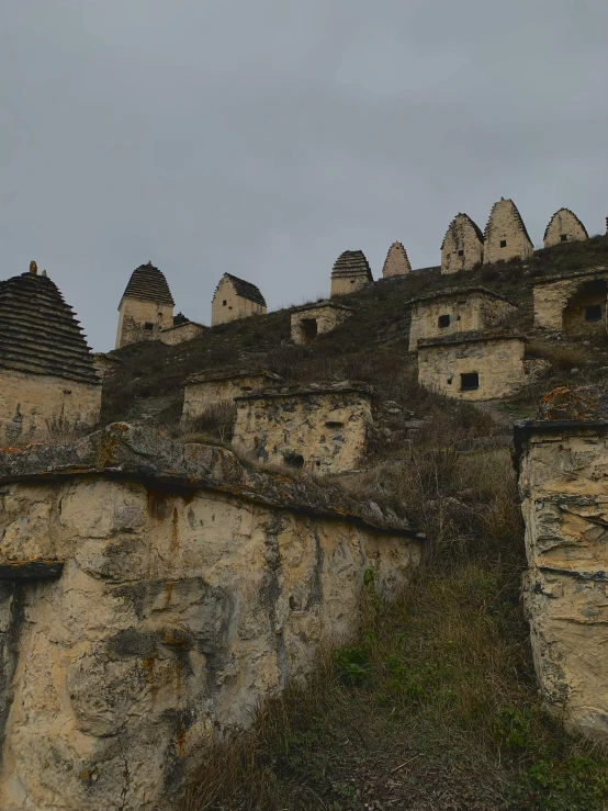 the stone houses have domes on the sides