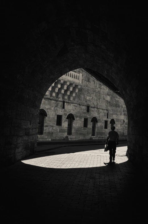 a person is standing in an archway way