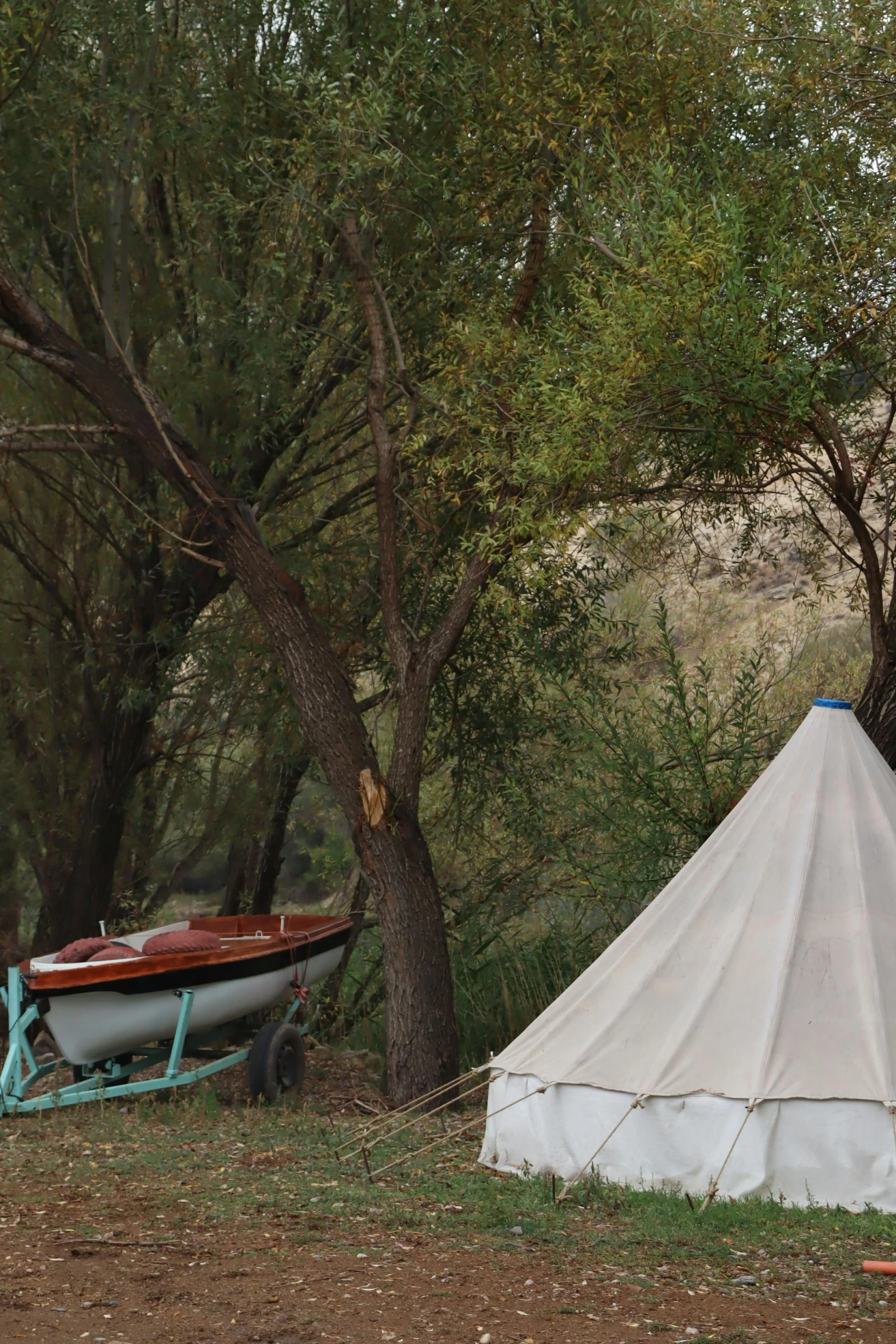 an image of a tent set up by the water