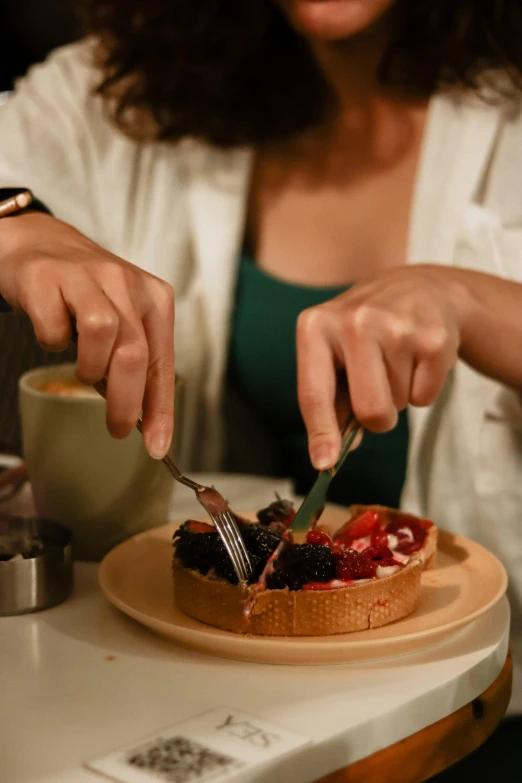 a woman at a table  a piece of pie