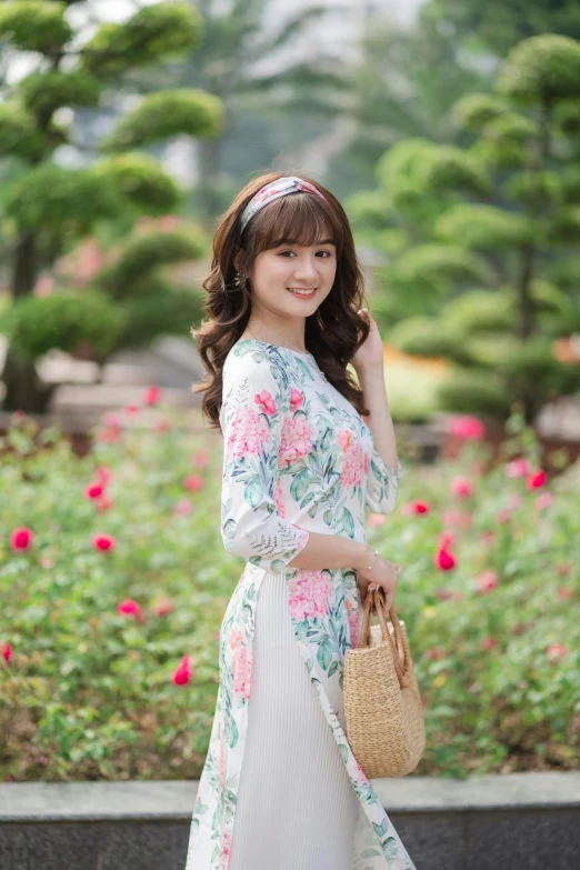 an attractive young woman walking in the garden