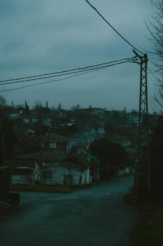 street scene, looking across an alley way to buildings, and overhead wire