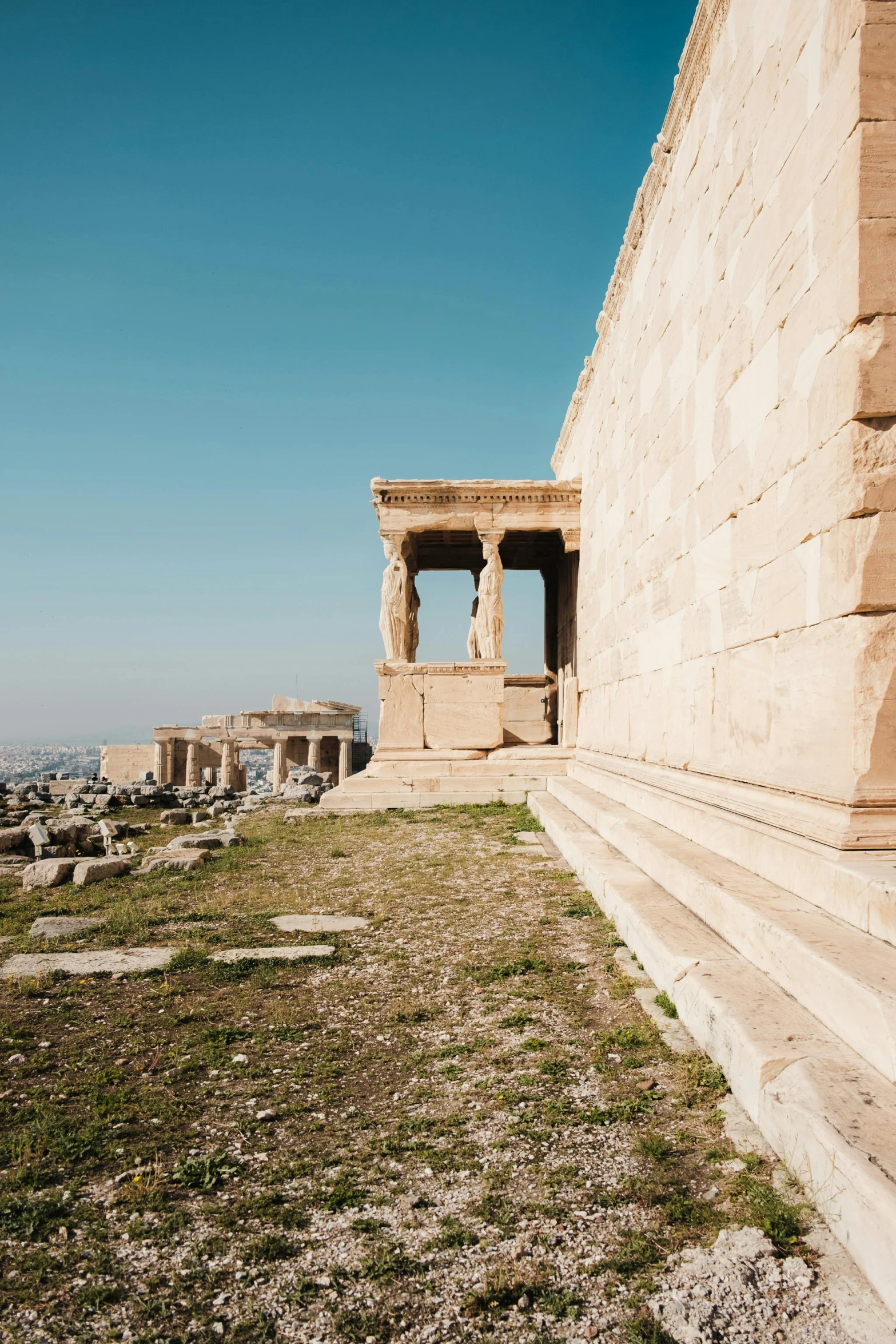 a large building with statues on top of it