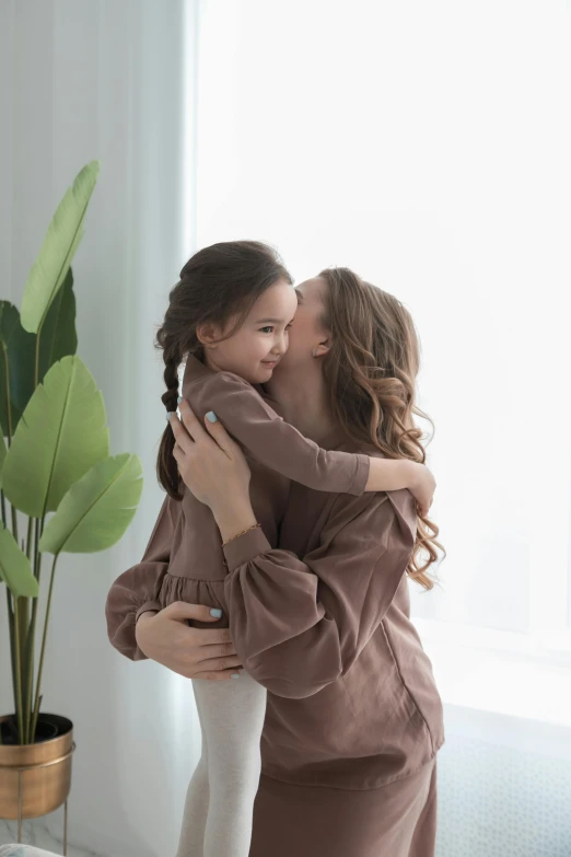 a couple of women standing next to each other