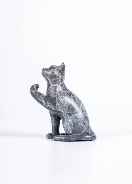 a cat sculpture on white background with no background