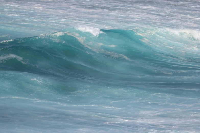 a man in the water riding a wave