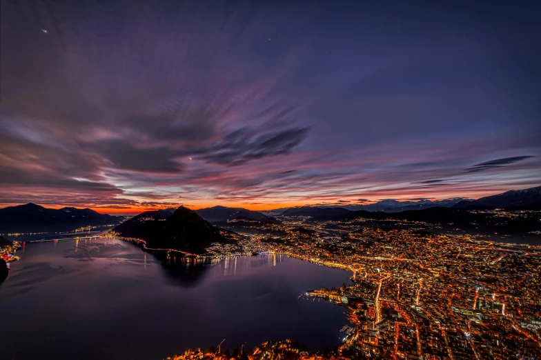 the city lights glow brightly as seen from an airplane