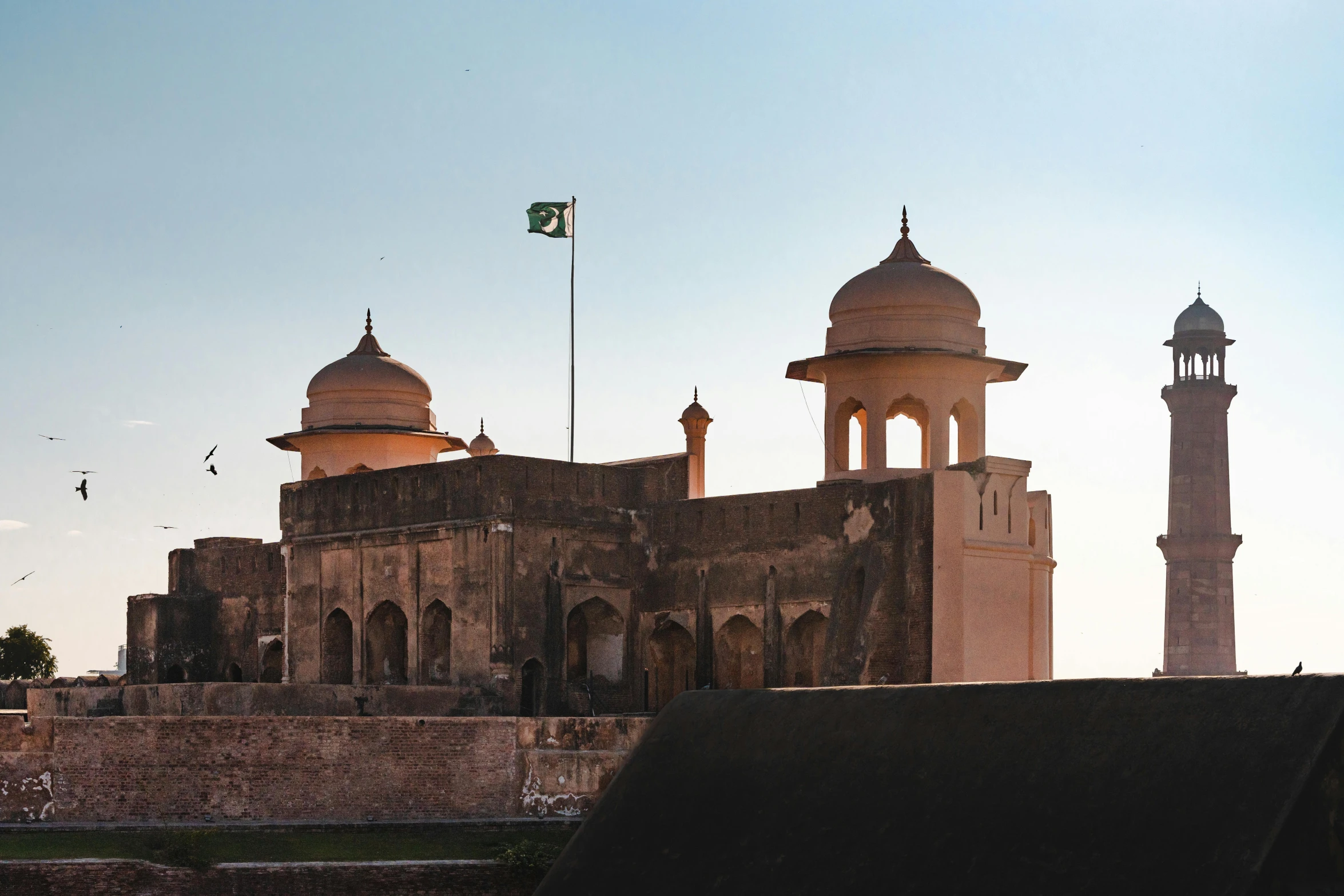 the view of the palace with a flag flying