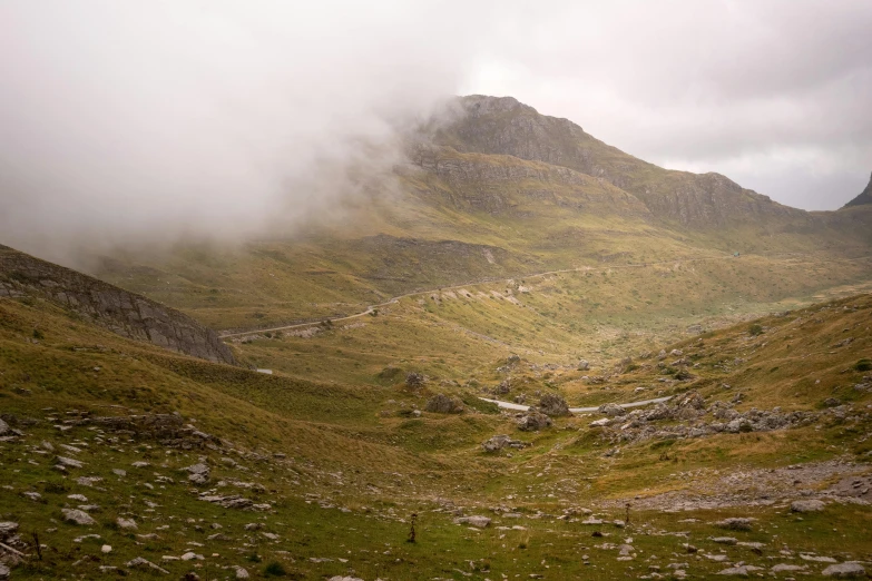 an image of a mountain in the fog