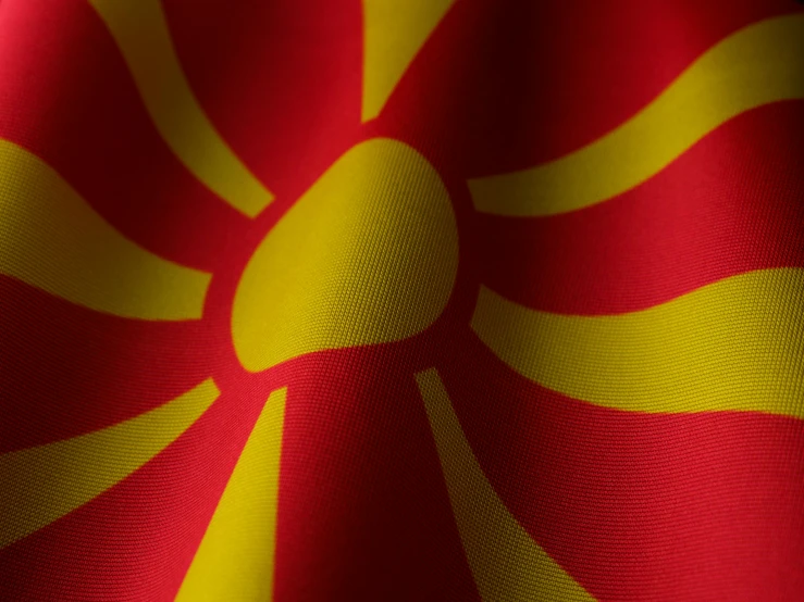 the image shows a red and yellow cloth with large folds