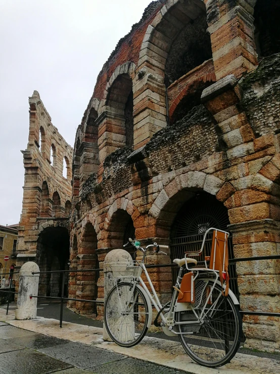 a bike parked outside an old brick structure