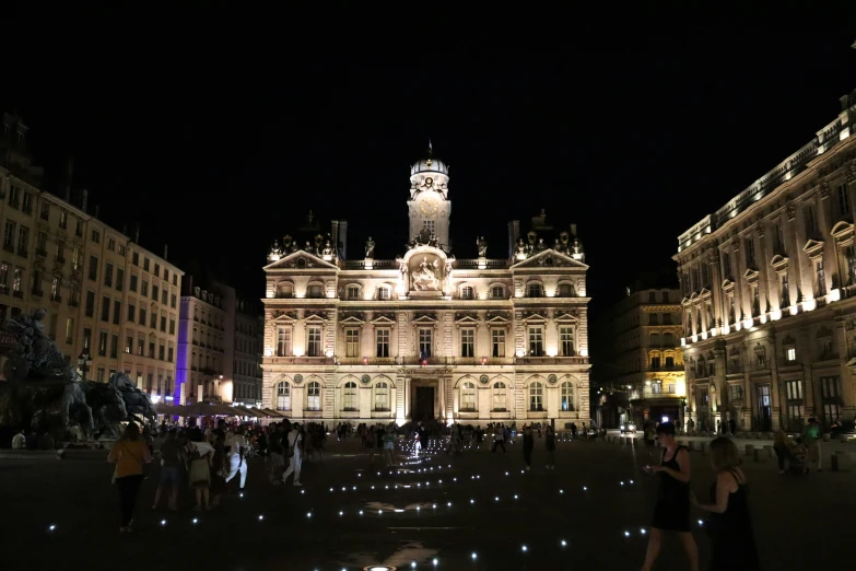 buildings are lit up in the dark on an otherwise dark night