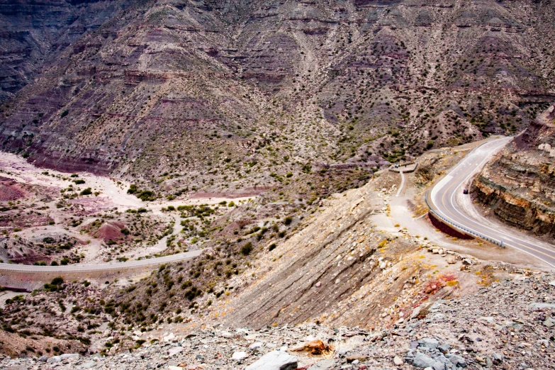 a road going through the mountains in the desert