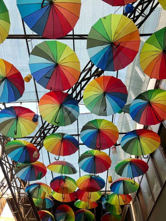 there are many umbrellas all over the store ceiling