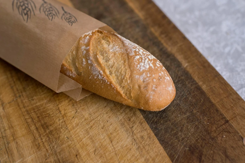 a piece of bread on a wooden board