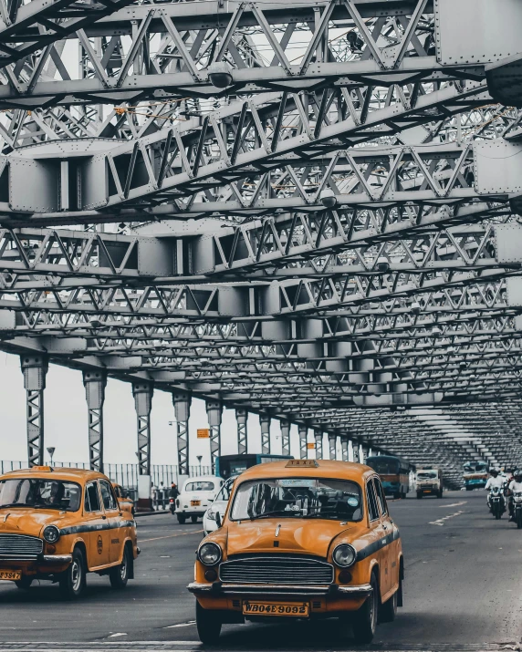 a city street with cars, trucks, and people walking