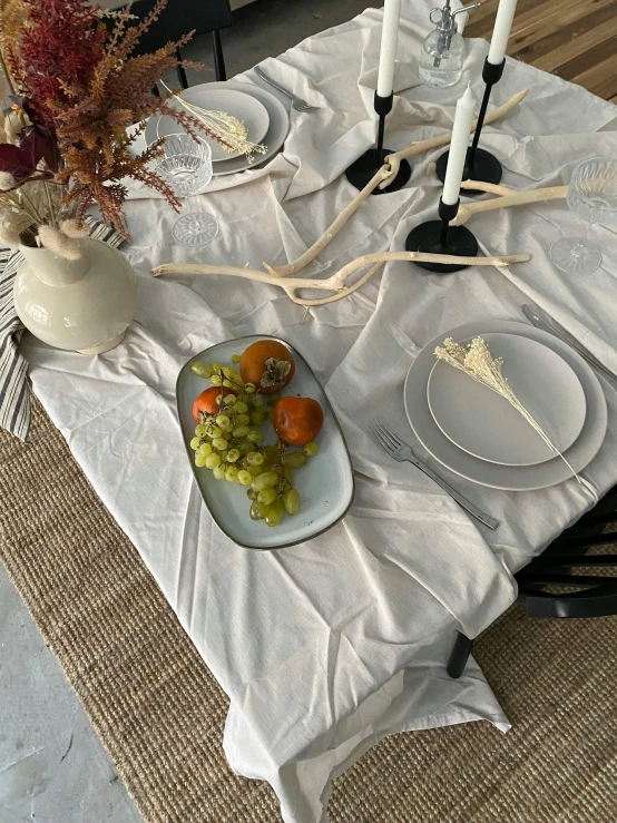 there is a dinner plate on the table with two wine glasses