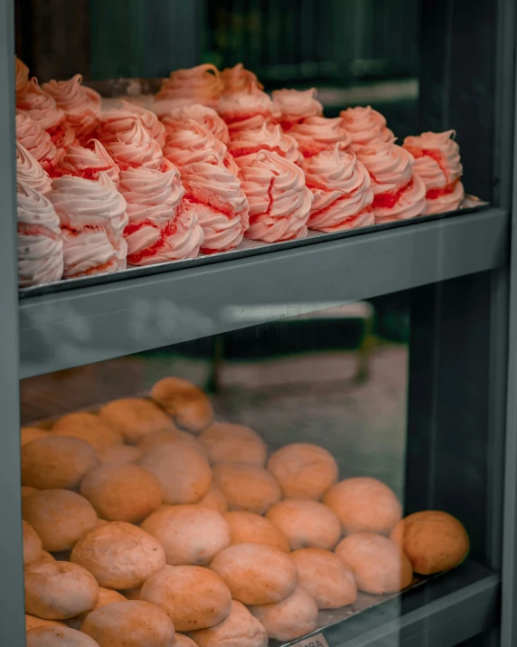 a rack full of cakes that are on display