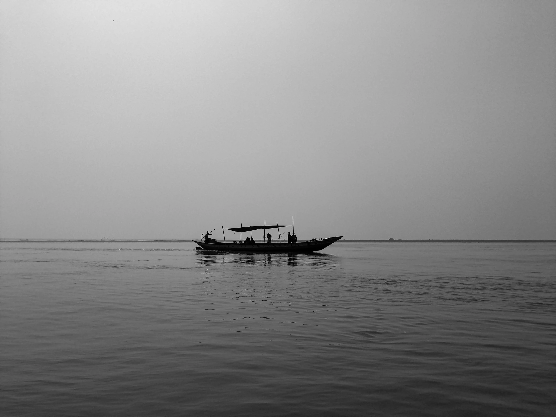 a black and white po of a small boat