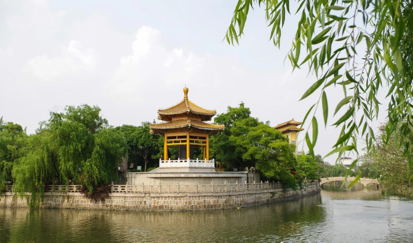 the pagoda sits on a hill by the water