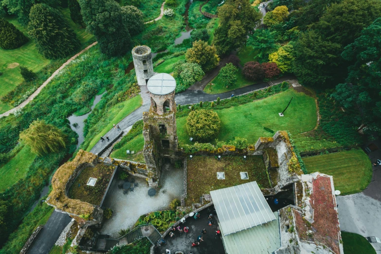 an aerial po of an old, small church with its steeple