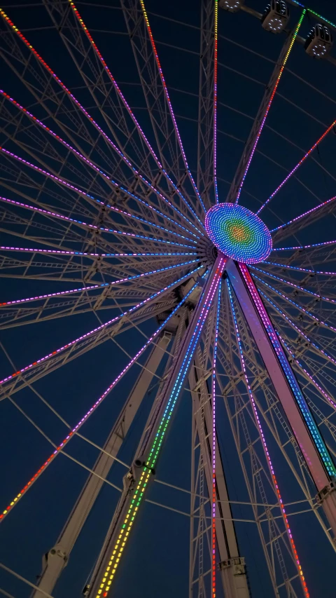 a ferris wheel lit up with christmas lights