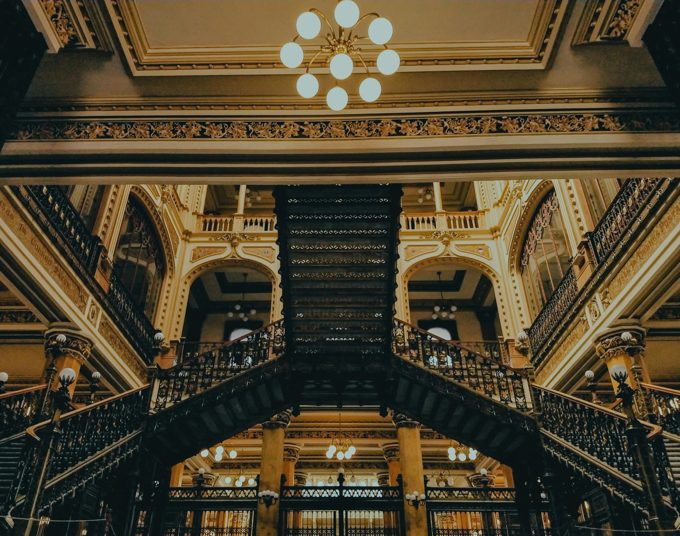 the interior of an ornate building with lots of light