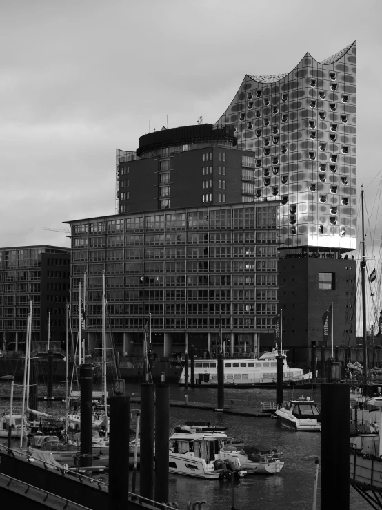 boats are in a harbor beside a building