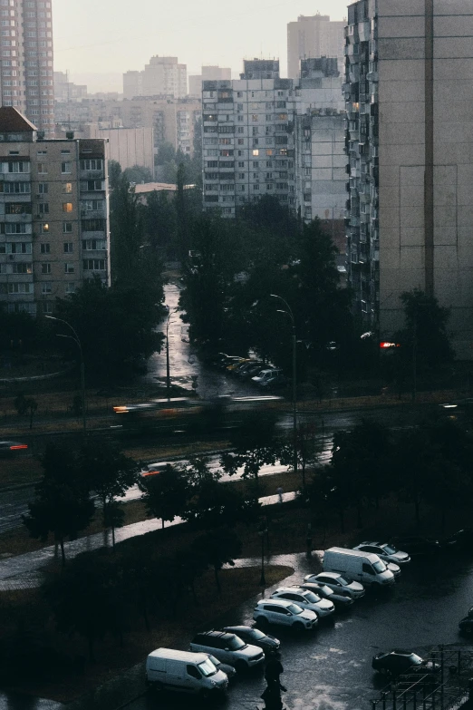 a parking lot in the city near a busy highway