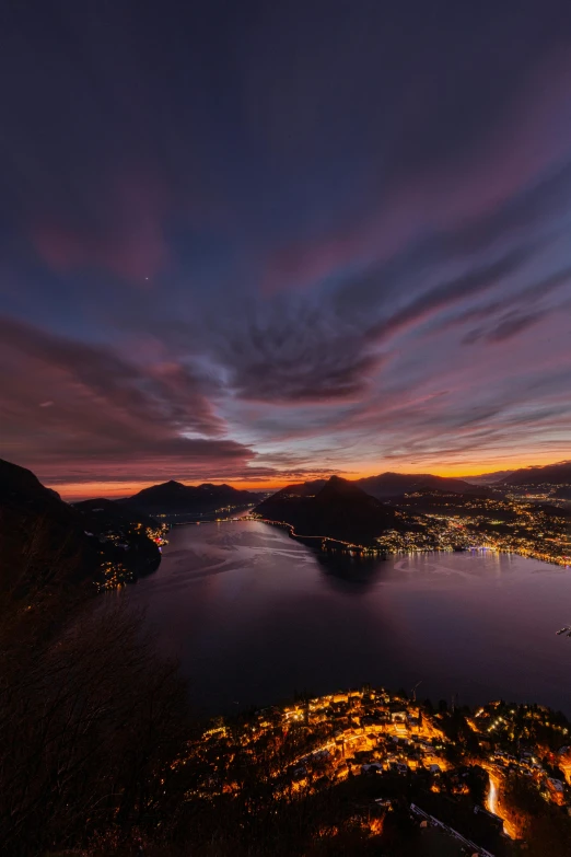 the view of a lake and mountain from a high vantage